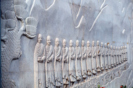 Minh Dang Quang buddhist temple. Monk's daily morning alms procession sculpture. Ho Chi Minh City. Vietnam.のeditorial素材