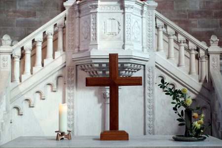 The Temple Nine protestant church. Wooden cross on an altar. Strasbourg. France.