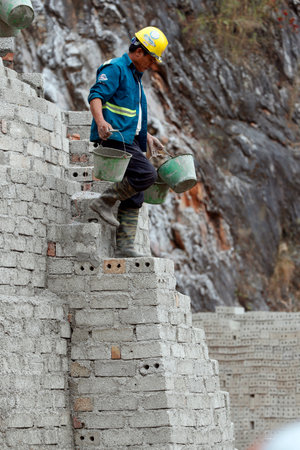 Worker on building site. Bac Sound. Vietnam.のeditorial素材