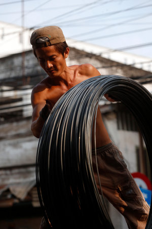 Steel rebar for concrete reinforcing construction building industry. Construction worker. Cai Be. Vietnam.のeditorial素材