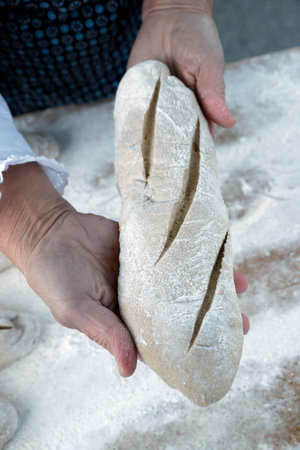 The agriculture fair (Comice Agricole) of Saint-Gervais-les-Bains. Baker making artisan bread.