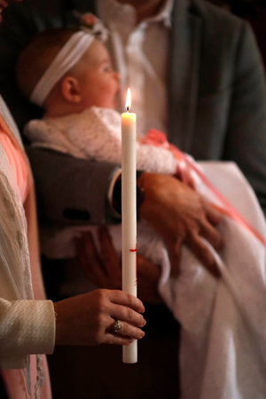 Catholic mass. Baptism. Saint-Nicolas de Veroce church. France.の写真素材