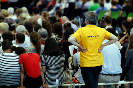 Ecumenical Pilgrimage of Pope Francis to Geneva. Catholic mass at the Palexpo hall. Volunteer. Switzerland.のeditorial素材