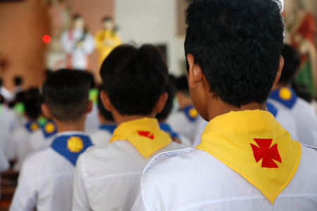 Christian children at sunday morning catholic mass. Chau Doc church. Vietnam.の写真素材