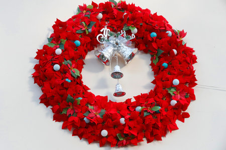 Christmas crown with red flowers and decorations.の写真素材