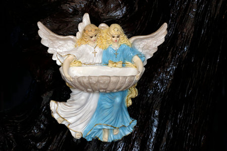 Holy water font with angels in a catholic church. Alright Hoa. Vietnam.の写真素材