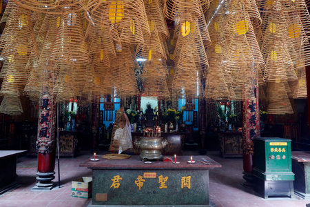 Taoist Ong pagoda. Incense coils hang from the ceiling. CanTho. Vietnam.のeditorial素材
