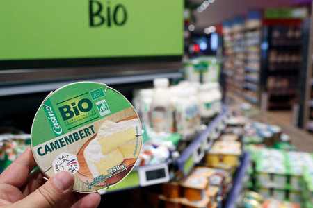 Supermarket. Organic food. French cheese: camembert. France.のeditorial素材