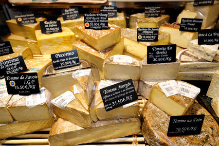 Gourmet shop. Tasty French cheese in assortment. France.のeditorial素材