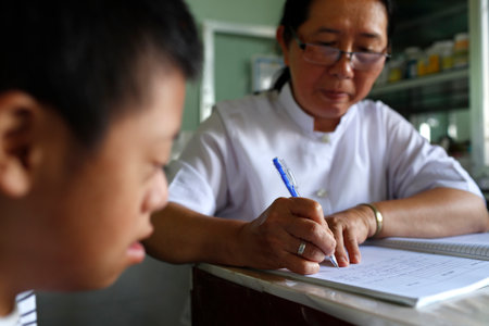 Free health clinic run by the Franciscan Missionaries of Mary. Medical consultation. Dalat. Vietnam.のeditorial素材