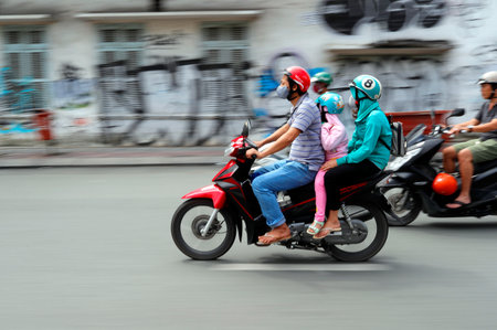 Vietnamese family on a motorbike. Ho Chi Minh City. Vietnam.のeditorial素材