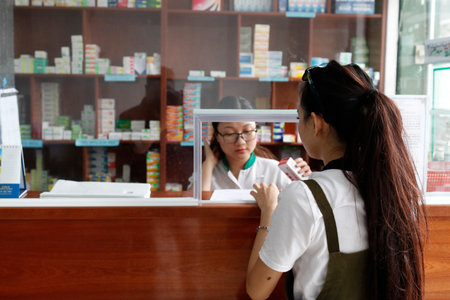 Pharmacy. Patient buying treatment. Vung Tau. Vietnam.のeditorial素材