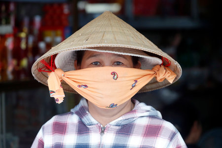 Vietnamese woman with conical hat. Portrait. Chau Doc. Vietnam.のeditorial素材