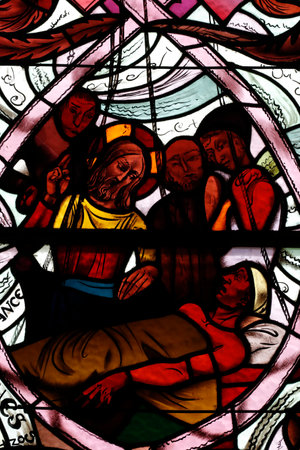 Saint Joseph des Fins church. Miracles of Jesus - Healing a Paralyzed Man. Stained glass window. Annecy. France.のeditorial素材