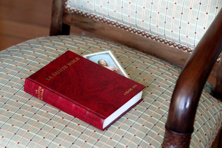 Bible on a chair in the interior of bedroom. France.のeditorial素材