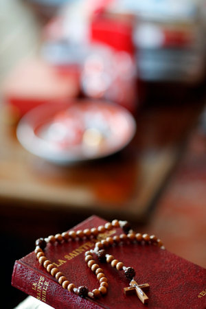Rosary and bible on a chair in the interior of bedroom. France.のeditorial素材