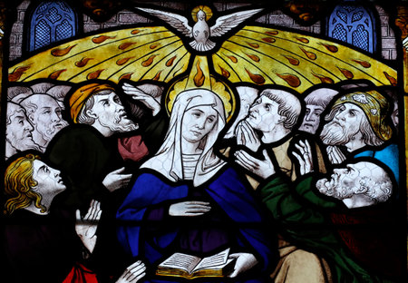Pentecost commemorates the descent of the Holy Spirit upon the Apostles and the Virgin. St Peter church. Stained glass window. Dreux. France.のeditorial素材