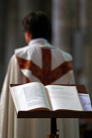 Wedding ceremony in a Catholic church. The priest. France.のeditorial素材