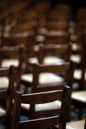Chambery cathedral. Empty church with wooden chairs. France.のeditorial素材