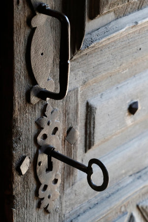 The baroque catholic chapel of the Chattrix. Old door with key. Saint Nicholas of Veroce. France.のeditorial素材