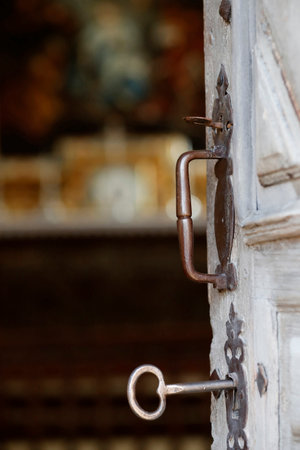 The baroque catholic chapel of the Chattrix. Old door with key. Saint Nicholas of Veroce. France.のeditorial素材