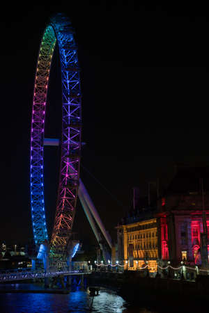 LONDON - MAY 6: London Eye, South Bank, illuminated by the colours of  the parties on election night, 6 May 2010のeditorial素材