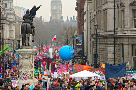 LONDON - MARCH 26: Protesters march down Whitehall against public expenditure cuts in a rally -- March for the Alternative -- organised by the Trades Union Congress (TUC), London, England,  March 26 2011のeditorial素材