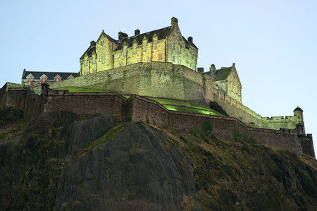Edinburgh Castle, illuminated at nightfall, in winter from the north west.のeditorial素材