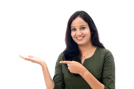 Happy young woman showing blank copy space