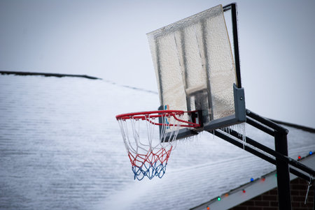 outdoor basketball hopp covered in ice