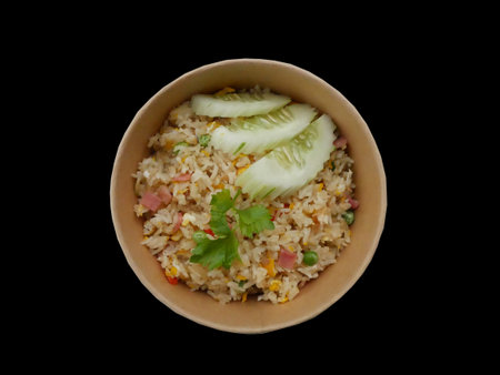 Thai food, fried type, crab fried rice, put in a paper cup box on a black background.の写真素材