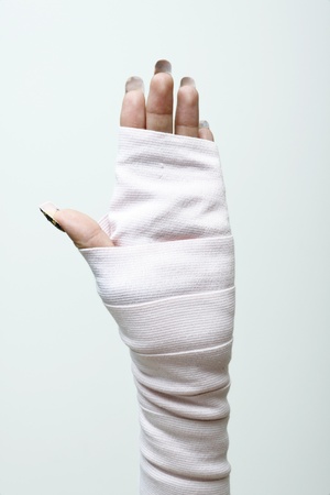 left hand and wrist in thick bandages.の写真素材