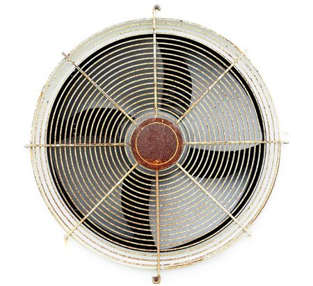 Old fan air compressor with frame on white wall の写真素材