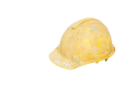 Dirty yellow hard hat on white background.の写真素材