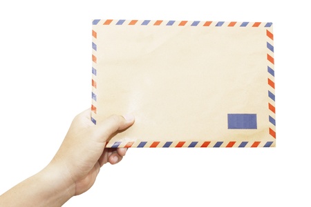 Brown envelope in the left hand isolated on white background の写真素材
