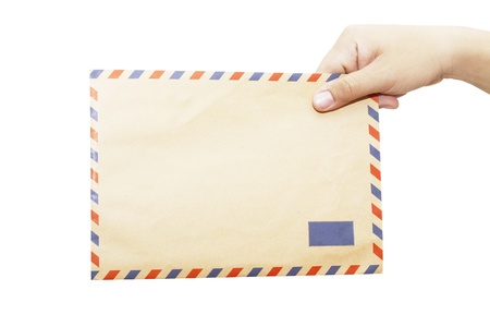 Brown envelope in the right hand isolated on white background の写真素材