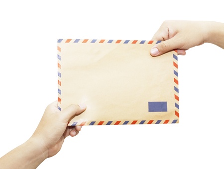 Passing mail, man s hand passes the envelope to another hand isolated on white background の写真素材