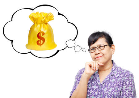 Thinking Asia woman looking up on thought bubble of money bagの写真素材