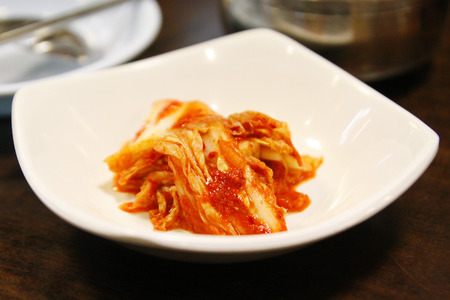 Korean food, close-up kimuchi on white dishの写真素材
