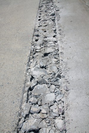 Concrete road is broken for repair at construction site.の写真素材