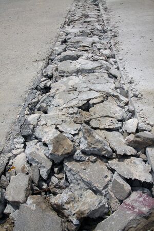 Concrete road is broken for repair at construction site.の写真素材
