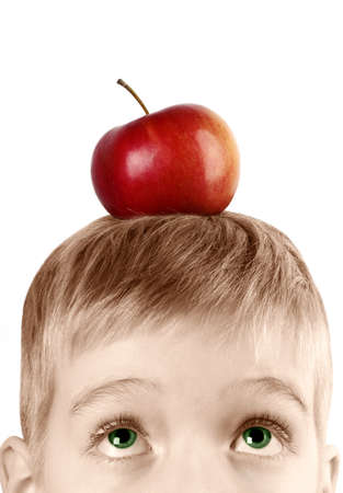 The child with an apple on his headの写真素材