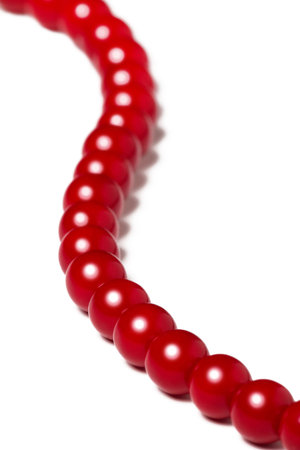 Red beads on the white backgroundの写真素材