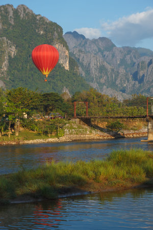 A red balloon starts flying from Laos  territoryの写真素材