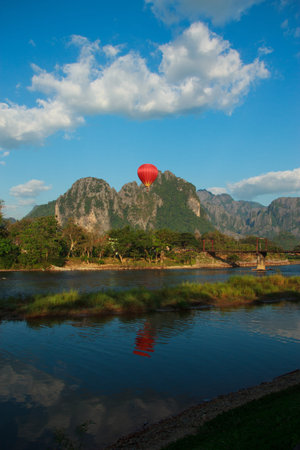 A red balloon with mountain and river backgroundの写真素材