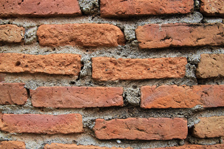 Orange bricks pack together on the wall of the temple at Ancient Siam