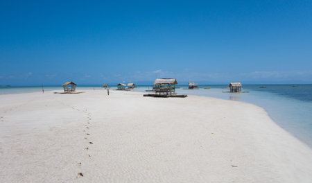 floating huts on a tropical beachの写真素材