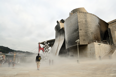 Mist shrouded Guggenheim Bilbao plaza, Basque Country Spainのeditorial素材