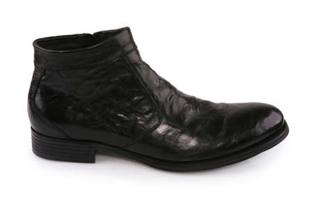 Black leather shoe isolated on whiteの写真素材
