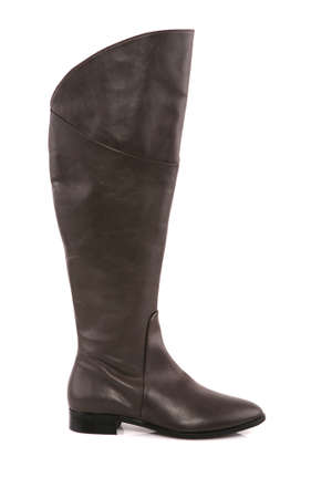 Female leather boot isolated on whiteの写真素材